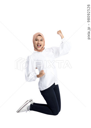Asian Muslim woman in a headscarf with an excited expression 98092526