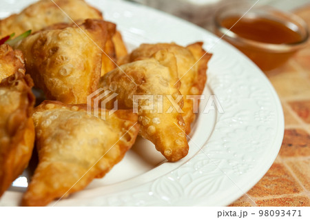 Wontons. Fried dumplings. Wontons. Fried dumplings. 98093471