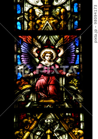 Stained glass window detail with Biblical scene 98094173