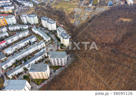 Drone view of urban environment, city taking place of nature Drone view of urban environment, city taking place of nature 98095126