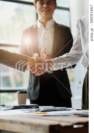 Business partnership meeting concept. Image businessmans handshake. Successful businessmen handshaking after good deal. Group support concept 98095867