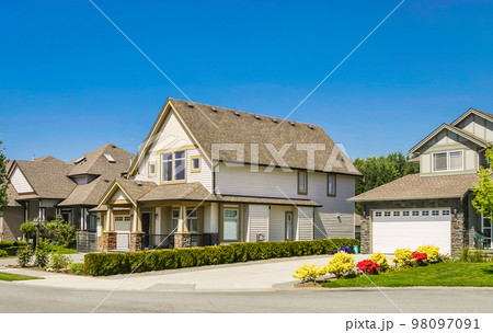 Big family house with concrete driveway to the garage 98097091