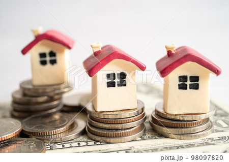 House model with growing plant on stack of coin money, home loan, saving plan, installment payment finance and banking concept. 98097820
