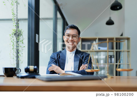 Portrait of a Asian man lawyer studying a lawsuit for a client before going to court. Portrait of a Asian man lawyer studying a lawsuit for a client before going to court. 98100200