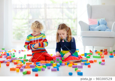 Kids play with toy blocks. Toys for children. Kids play with toy blocks. Toys for children. 98100529