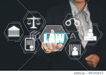 Justice and law concept, Businesswoman hand touching law icon on virtual screen on drak background. 98102617