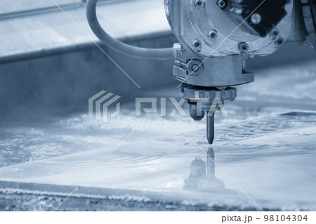 Close-up scene of multi-axis abrasive waterjet cutting machine cutting the aluminum plate. 98104304