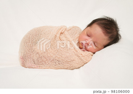 newborn baby sleep in cloth wrap blanket on bed newborn baby sleep in cloth wrap blanket on bed 98106000