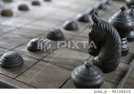 Ancient chess pieces made of wood Ancient chess pieces made of wood 98106628