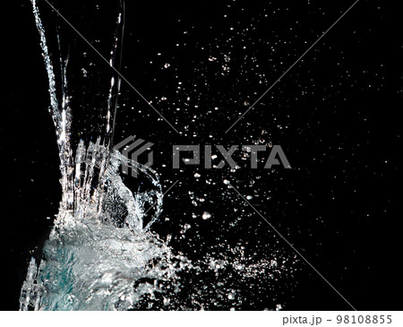 Water hit wall ground, explode into drop droplet. Amount Water attack impact and fluttering in air explosion. Stop motion freeze shot. Splash Water for texture elements, black background isolated 98108855