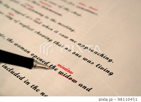 spelling check paperwork with red mark spelling check paperwork with red mark 98110451