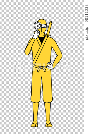 A man in a ninja costume looking through a magnifying glass 98111338