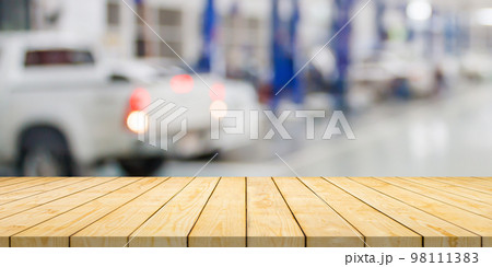 Empty wood table top with car service centre auto repair workshop blurred background Empty wood table top with car service centre auto repair workshop blurred background 98111383