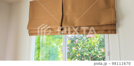 Roman blind curtain decoration in living room interior Roman blind curtain decoration in living room interior 98111670