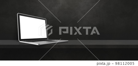 Laptop computer on black shelf background banner Laptop computer on black shelf background banner 98112005