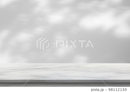 Marble table with tree shadow drop on white wall background for mockup product display 98112130