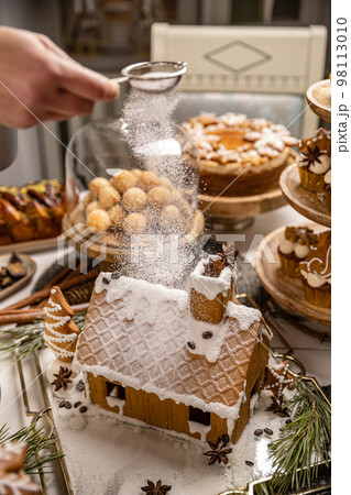 Festive Christmas table with sweets Festive Christmas table with sweets 98113010