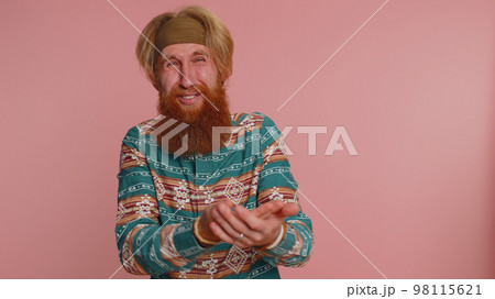 Upset disappointed bearded man wipes tears, cries from despair, being sad because of unfair things Upset disappointed bearded man wipes tears, cries from despair, being sad because of unfair things 98115621