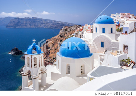 Oia village with churches against Aegean sea on Santorini island in Greece Oia village with churches against Aegean sea on Santorini island in Greece 98117611