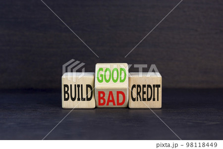 Build good or bad credit symbol. Concept word Build good or bad credit on wooden cubes. Beautiful black table black background. Business and build good or bad credit concept. Copy space. 98118449