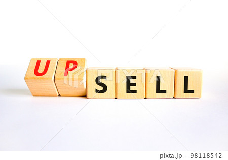Sell or upsell symbol. Concept word Sell Upsell on wooden cubes. Beautiful white table white background. Business Sell or Upsell concept. Copy space. 98118542