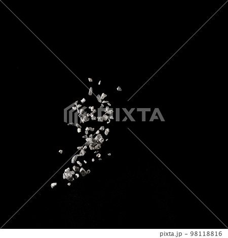 Mixed stone explosion on black background. 98118816