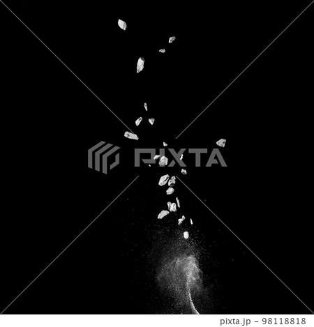 Mixed stone explosion on black background. 98118818