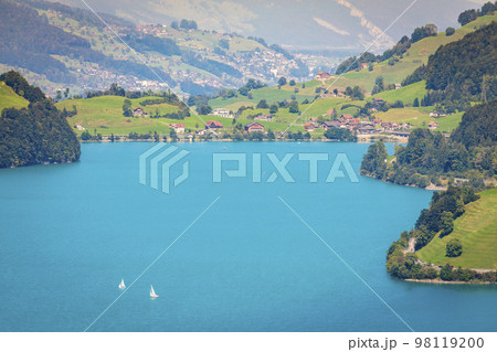 Turquoise Lungernsee and village lungern in the Swiss Alps, Switzerland Turquoise Lungernsee and village lungern in the Swiss Alps, Switzerland 98119200