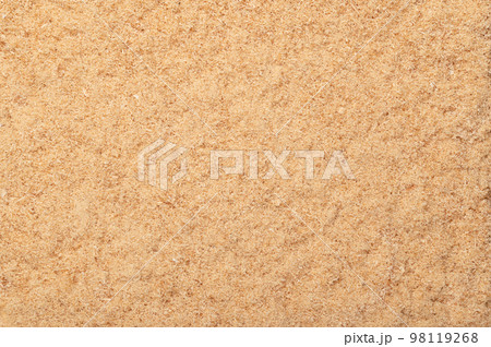 Fine sawdust, a wood flour and powder, formed by sawing dried spruce. Finely pulverized wood, a by-product and waste product, mainly used as a filler and extender. Surface and background, from above. Fine sawdust, a wood flour and powder, formed by sawing dried spruce. Finely pulverized wood, a by-product and waste product, mainly used as a filler and extender. Surface and background, from above. 98119268