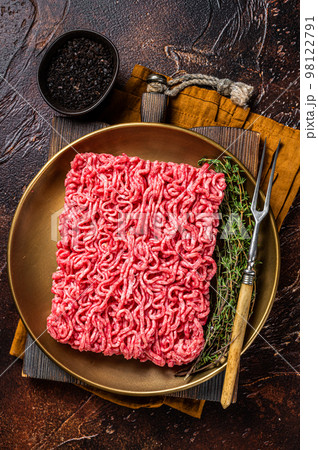 Fresh mutton lamb Mince Meat, raw ground meat. Dark background. Top view 98122791