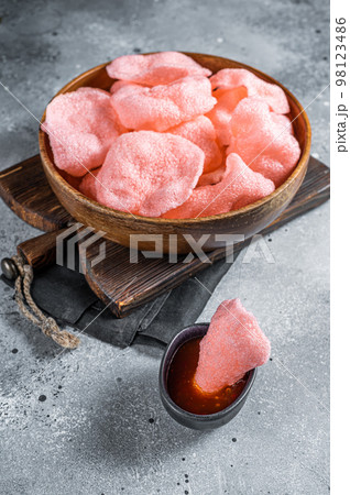 Crunchy kerupuk prawn shrimp crackers, chips. Gray background. Top view 98123486