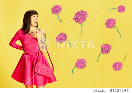 Creative colorful design. Modern art collage. Emotive, beautiful young girl in pink clothes posing over bright yellow background with flowers 98124147