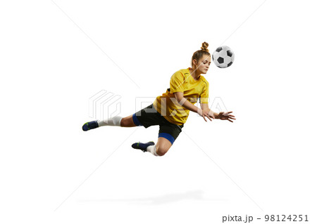 Hitting ball with head. Young woman, professional female football, soccer player in motion, training, playing isolated over white background 98124251