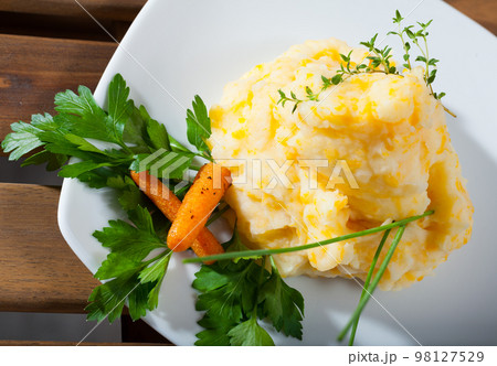 Mashed potato with carrots and herbs 98127529