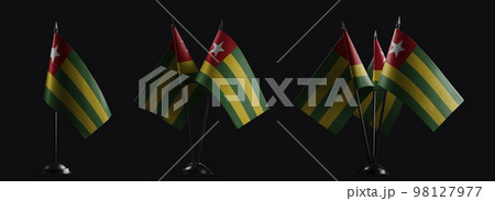 Small national flags of the Togo on a black background 98127977