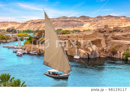 Nile River scenery with famous sailboats, Aswan, Egypt Nile River scenery with famous sailboats, Aswan, Egypt 98129117