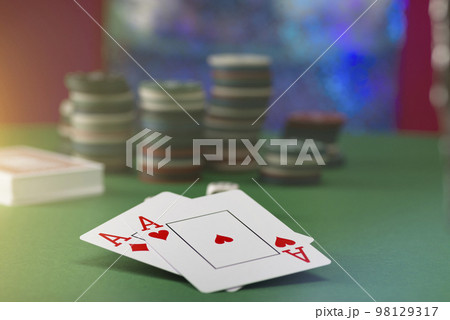 Two aces and stack of Casino Chips in background Two aces and stack of Casino Chips in background 98129317