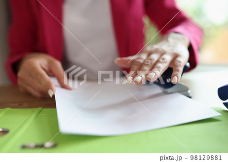 Close-up image of business woman working with documents in office. 98129881