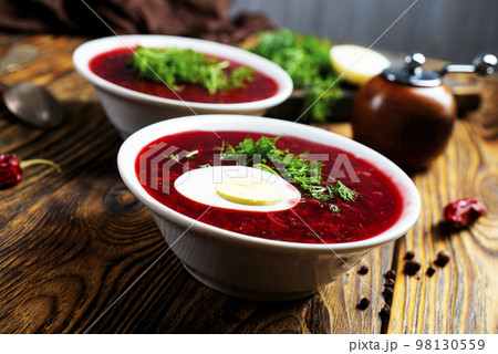 Traditional Ukrainian Russian borscht . Bowl of red beet root soup borsch with white cream . Beet Root delicious soup . Traditional Ukrainian food cuisine Traditional Ukrainian Russian borscht . Bowl of red beet root soup borsch with white cream . Beet Root delicious soup . Traditional Ukrainian food cuisine 98130559