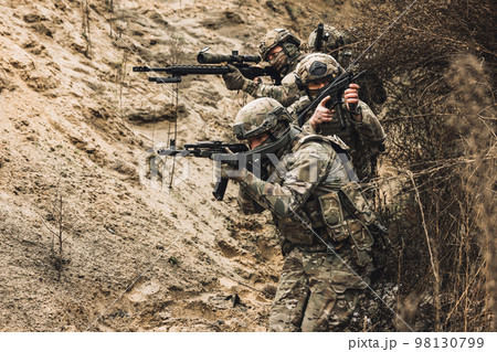 Group of soldiers with rifles before combat Group of soldiers with rifles before combat 98130799