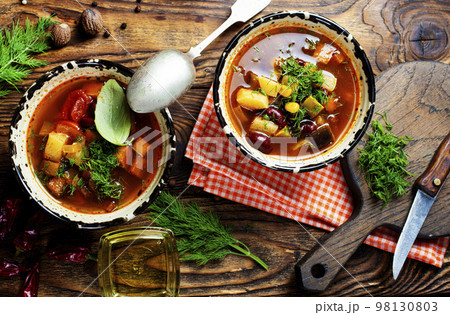 Chili soup in bowl with corn and been on dark background. Mexican cuisine. Top view Chili soup in bowl with corn and been on dark background. Mexican cuisine. Top view 98130803