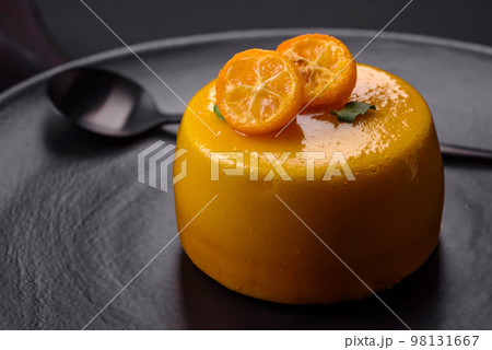 Delicious fresh tartlet with citrus filling and decorated with passion fruit Delicious fresh tartlet with citrus filling and decorated with passion fruit 98131667
