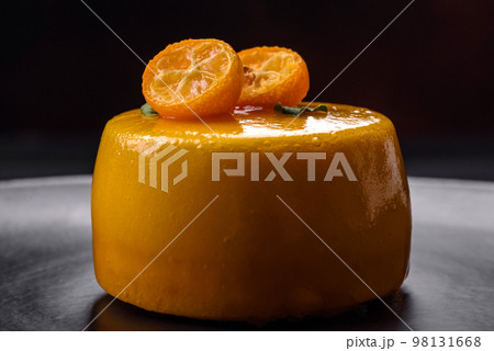 Delicious fresh tartlet with citrus filling and decorated with passion fruit Delicious fresh tartlet with citrus filling and decorated with passion fruit 98131668