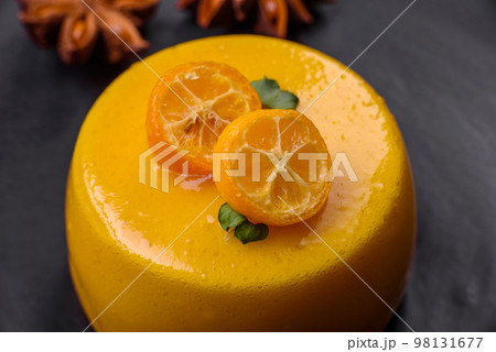 Delicious fresh tartlet with citrus filling and decorated with passion fruit Delicious fresh tartlet with citrus filling and decorated with passion fruit 98131677