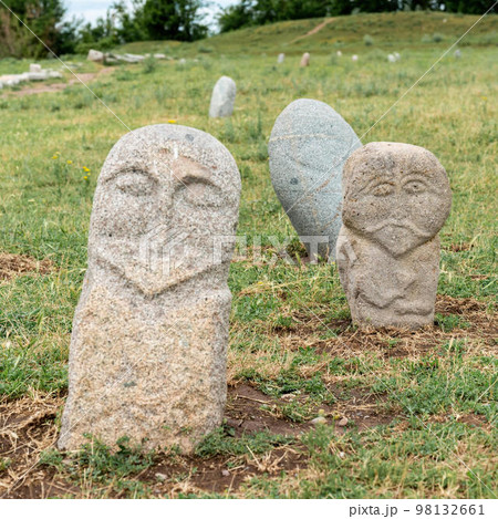 Historical stone sculptures near Old Burana tower that depict various figures and scenes from Kyrgyz history and culture. These sculptures provide insight into country's rich history and traditions Historical stone sculptures near Old Burana tower that depict various figures and scenes from Kyrgyz history and culture. These sculptures provide insight into country's rich history and traditions 98132661