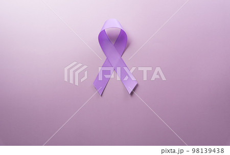 Purple ribbon on pastel paper background for supporting World Cancer Day campaign on February 4. 98139438