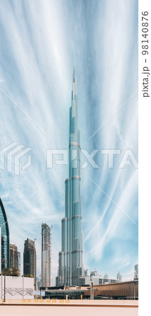 View of Burj Khalifa against clear sky. View of landmarks of residential district in Dubai Marina. Burj Khalifa, known as the Burj Dubai with a total height of 828 m. Vertical photo 98140876