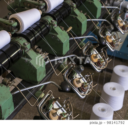 Thread spools at rewinding machine view 98141792