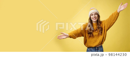Friendly happy charming smiling cute girl inviting friends joyfully spread hands embracing wanna hug cuddle dear guest grinning cheerful, having fun expressing postivity good mood Friendly happy charming smiling cute girl inviting friends joyfully spread hands embracing wanna hug cuddle dear guest grinning cheerful, having fun expressing postivity good mood 98144230