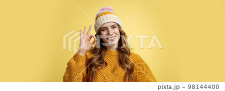 Everything under control. Self-assured optimstic lucky cute girl show okay ok gesture smiling happily having things alright, fine recommend awesome product, pleased standing yellow background Everything under control. Self-assured optimstic lucky cute girl show okay ok gesture smiling happily having things alright, fine recommend awesome product, pleased standing yellow background 98144400